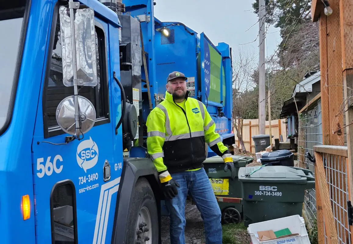 garbage truck and worker