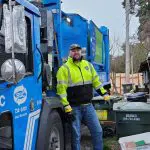 garbage truck and worker