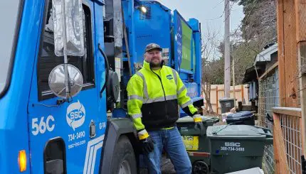 garbage truck and worker