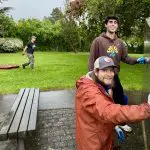 Two people clean a monument.