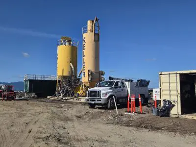 Two yellow structures standing tall on a construction site