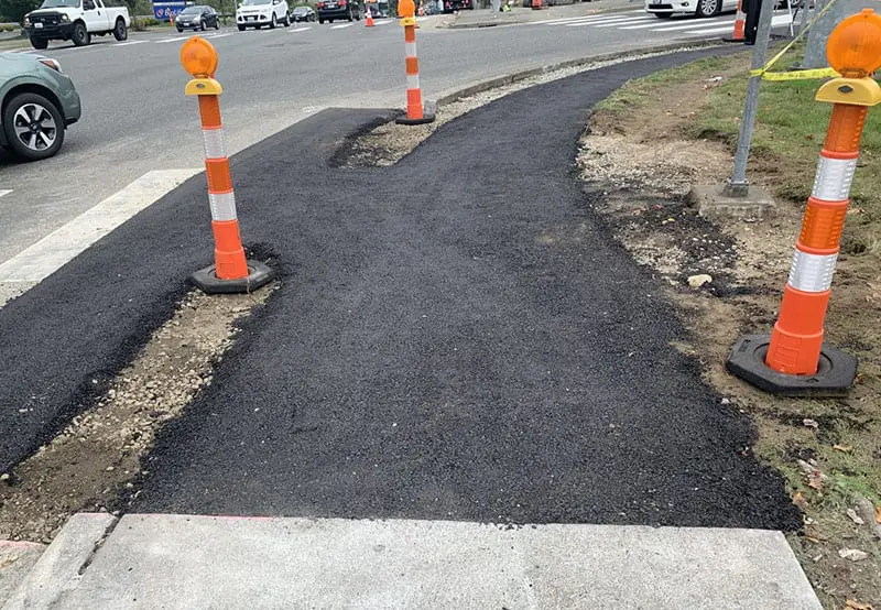 newly poured asphalt ramp still under construction