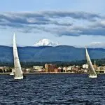 Boats sailing on clear water on Bellingham Bay