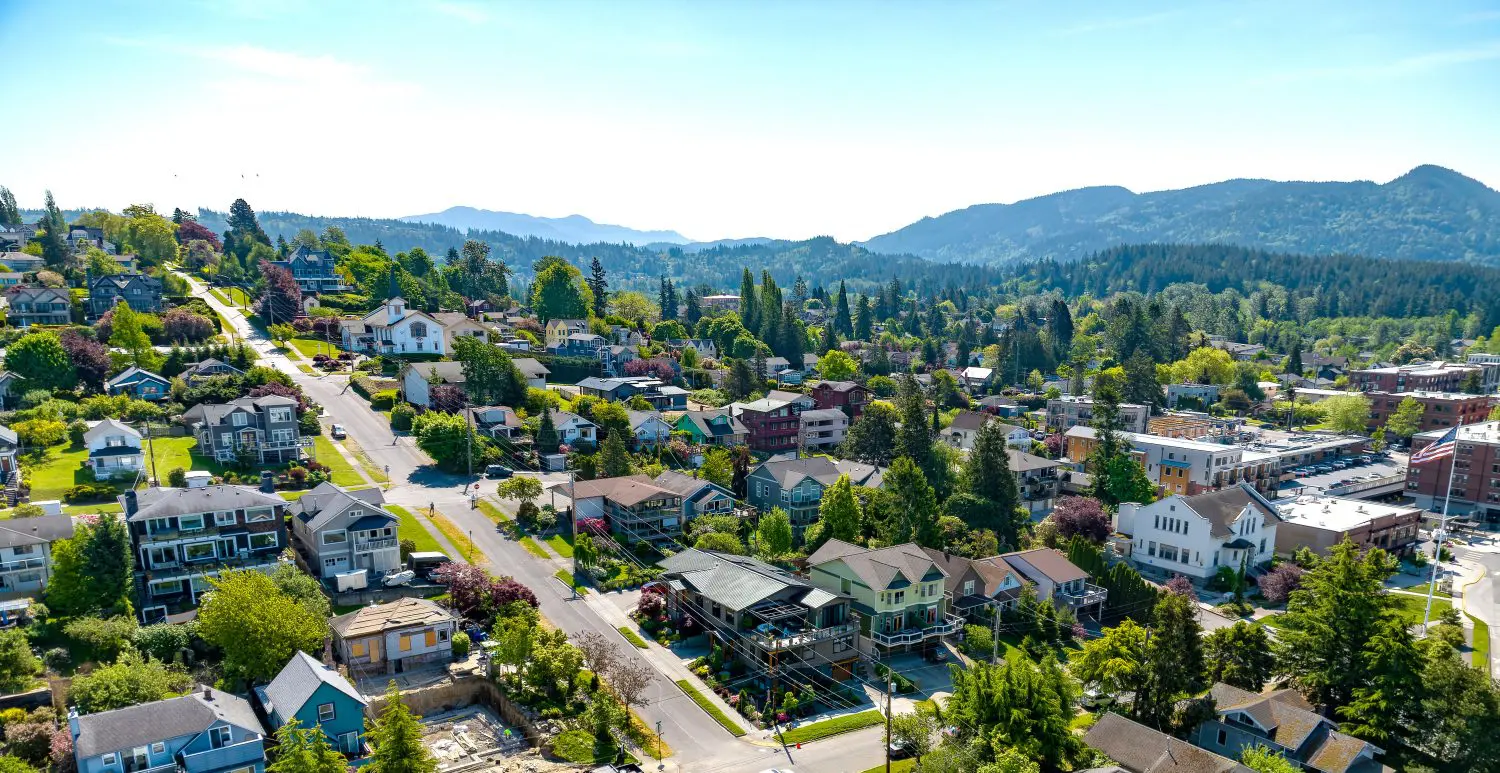 Aerial view of houses in Fairhaven with mountains in the background.