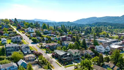 Aerial view of houses in Fairhaven with mountains in the background.