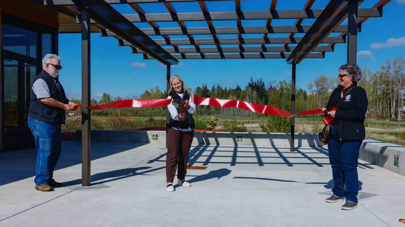 Mayor Kim Lund cuts a ribbon at the pavilion