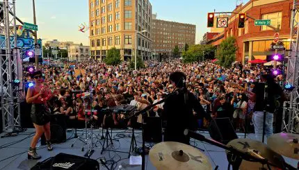 Musicians performing for a large audience