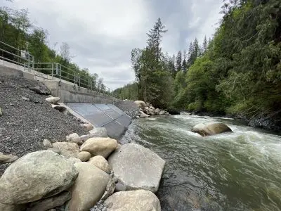 The intake structure shown from river level. The intake structure has a metal grate that water can pass through.