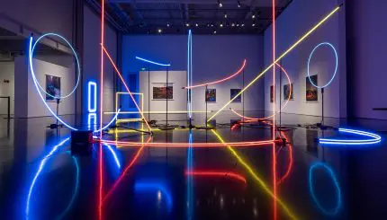 A picture of a museum exhibit featuring neon shapes