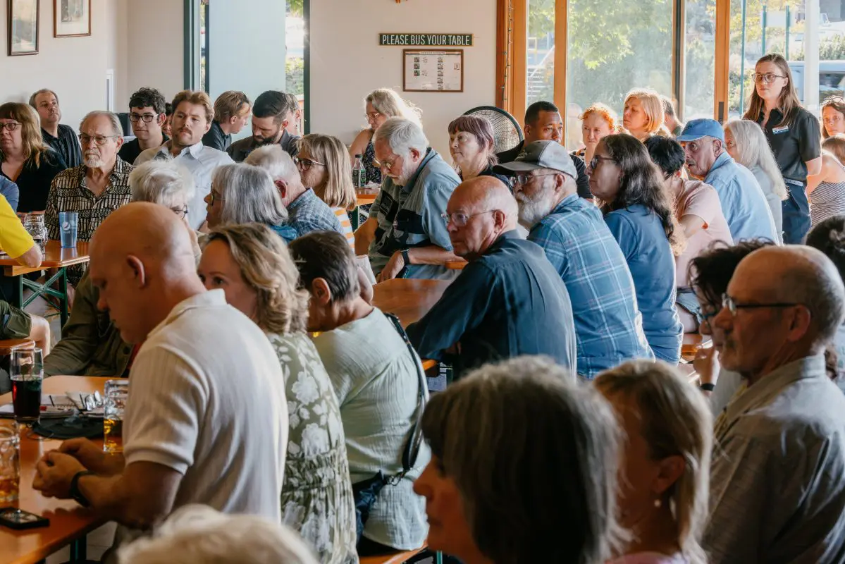 Event attendees sit in a bar