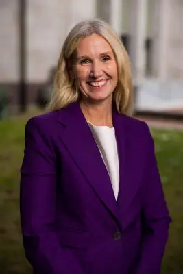 Mayor Kim Lund stands in front of City Hall