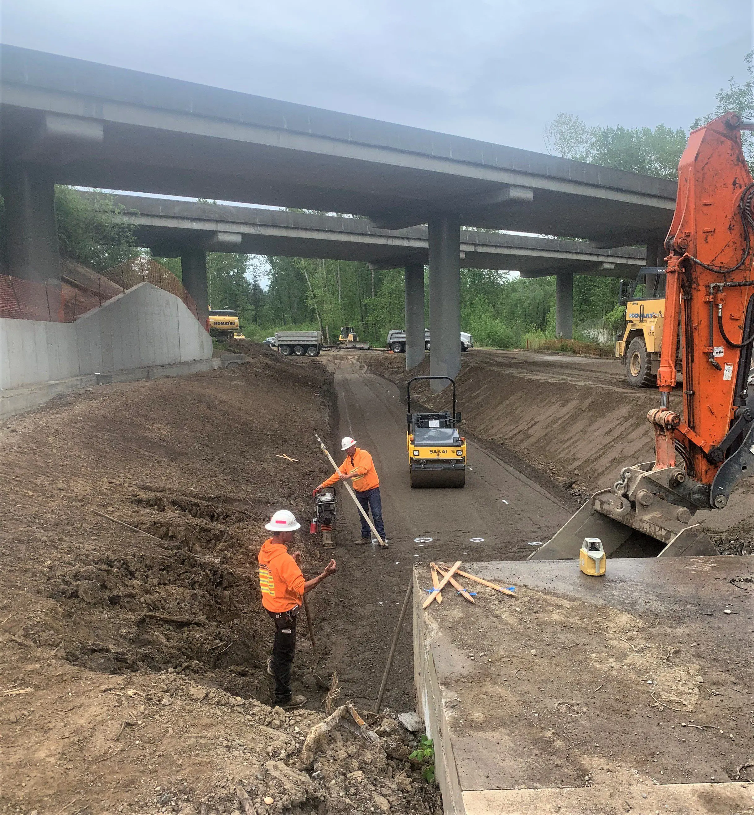 Orchard connector workers along smooth dirt road