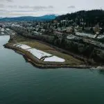 An aerial view of a coastal park and city