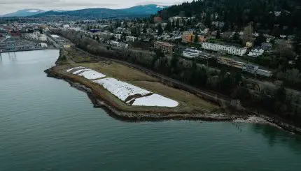 An aerial view of a coastal park and city