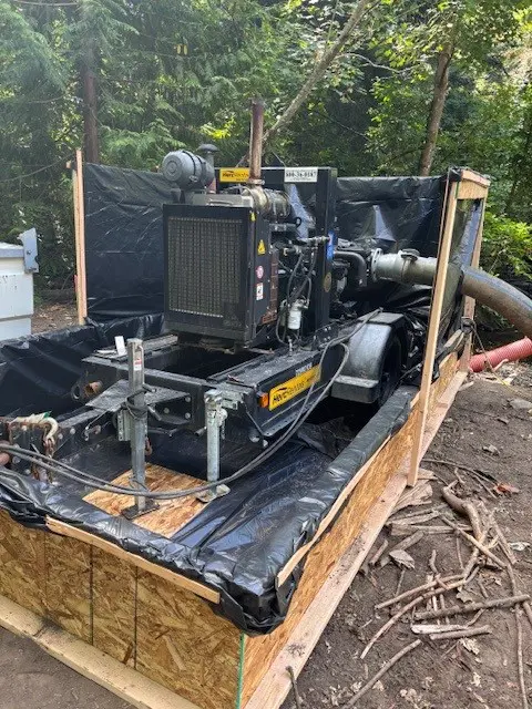 Pump with containment area around it
