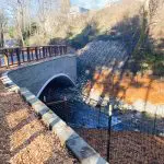A trail bridge over a stream
