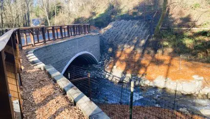 A trail bridge over a stream