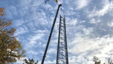 Tall metal tower with crane