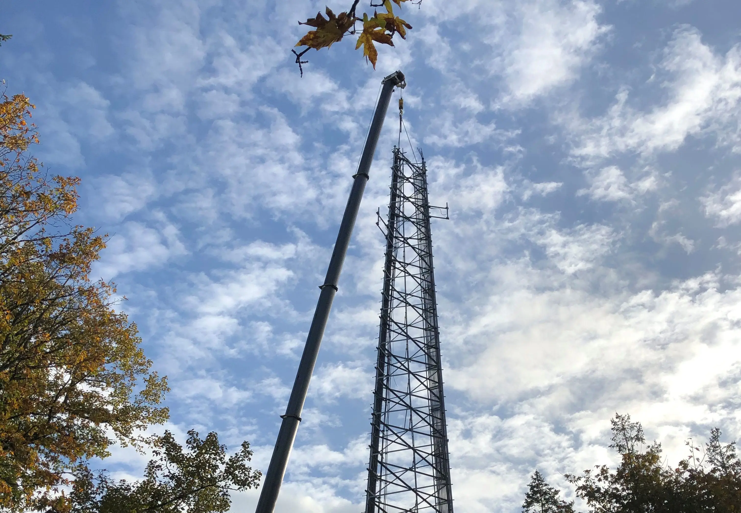 Tall metal tower with crane