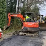 Construction equipment in roadway with fire hydrant nearby