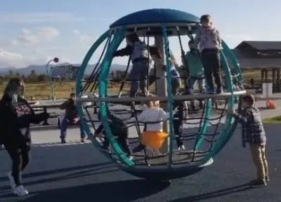 Climbing structure at Cordata Park A sphere-shaped climbing structure in a playground