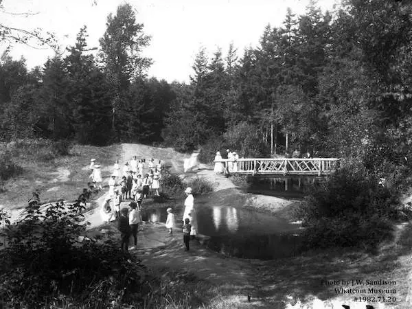 A historic photo of people in a park.