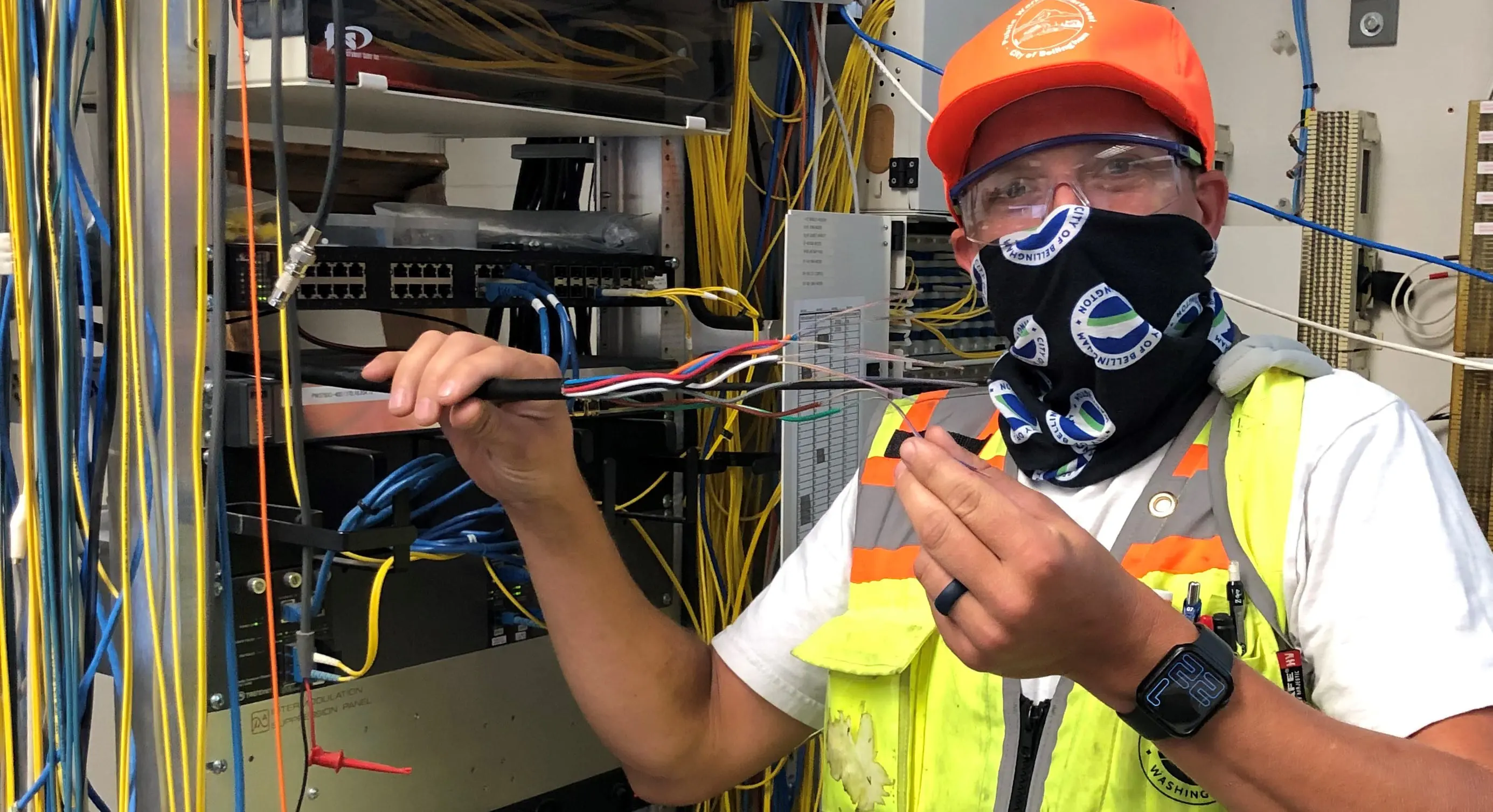 City employee holding up cables