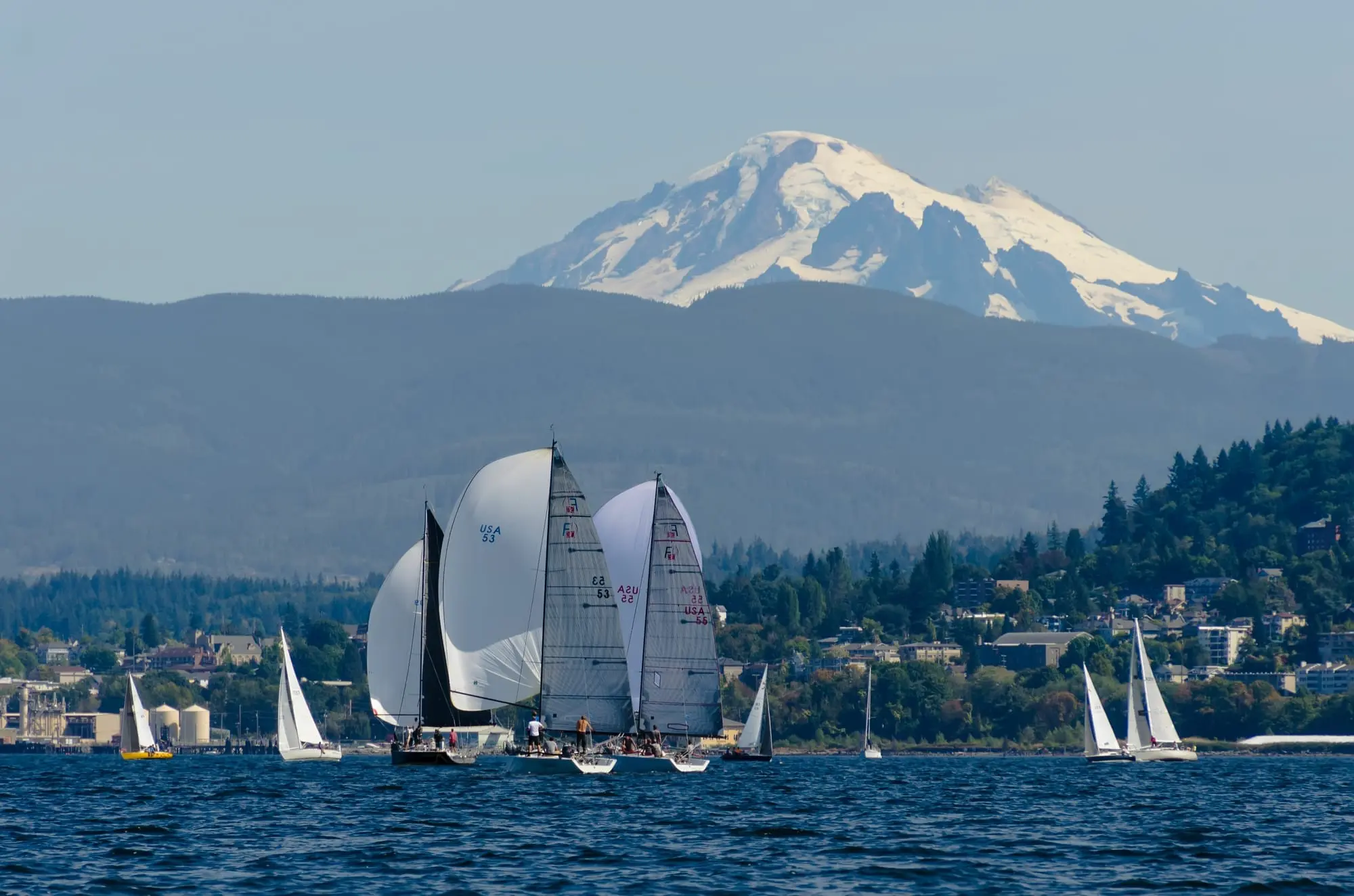 Sailboats on the bay with Mount Baker in the background.