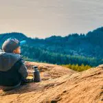 A young child looks out at the Bellingham Bay from the Chuckanut Mountains