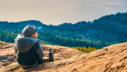 A young child looks out at the Bellingham Bay from the Chuckanut Mountains