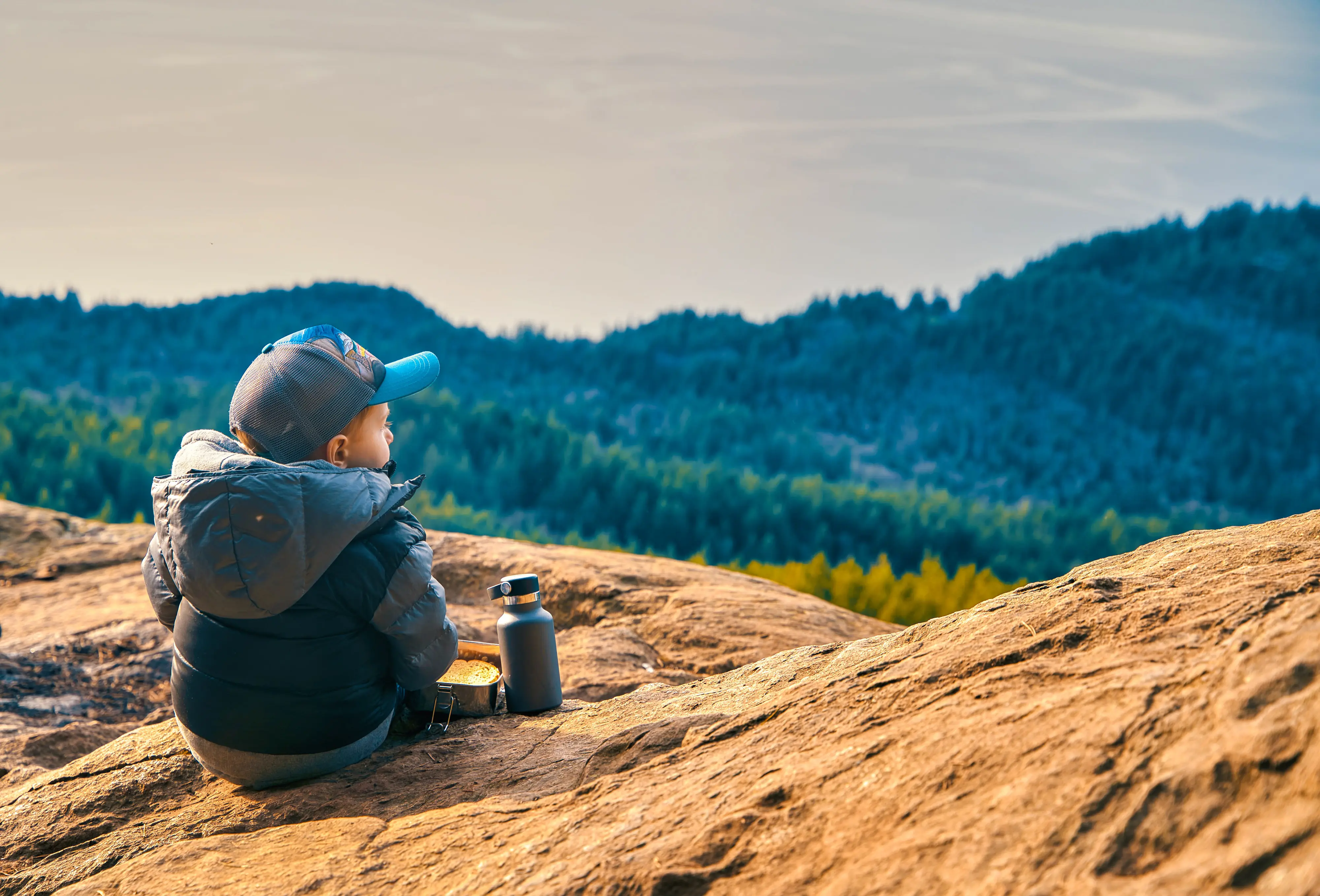 A young child looks out at the Bellingham Bay from the Chuckanut Mountains