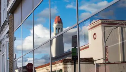 A reflection of a City street in a window