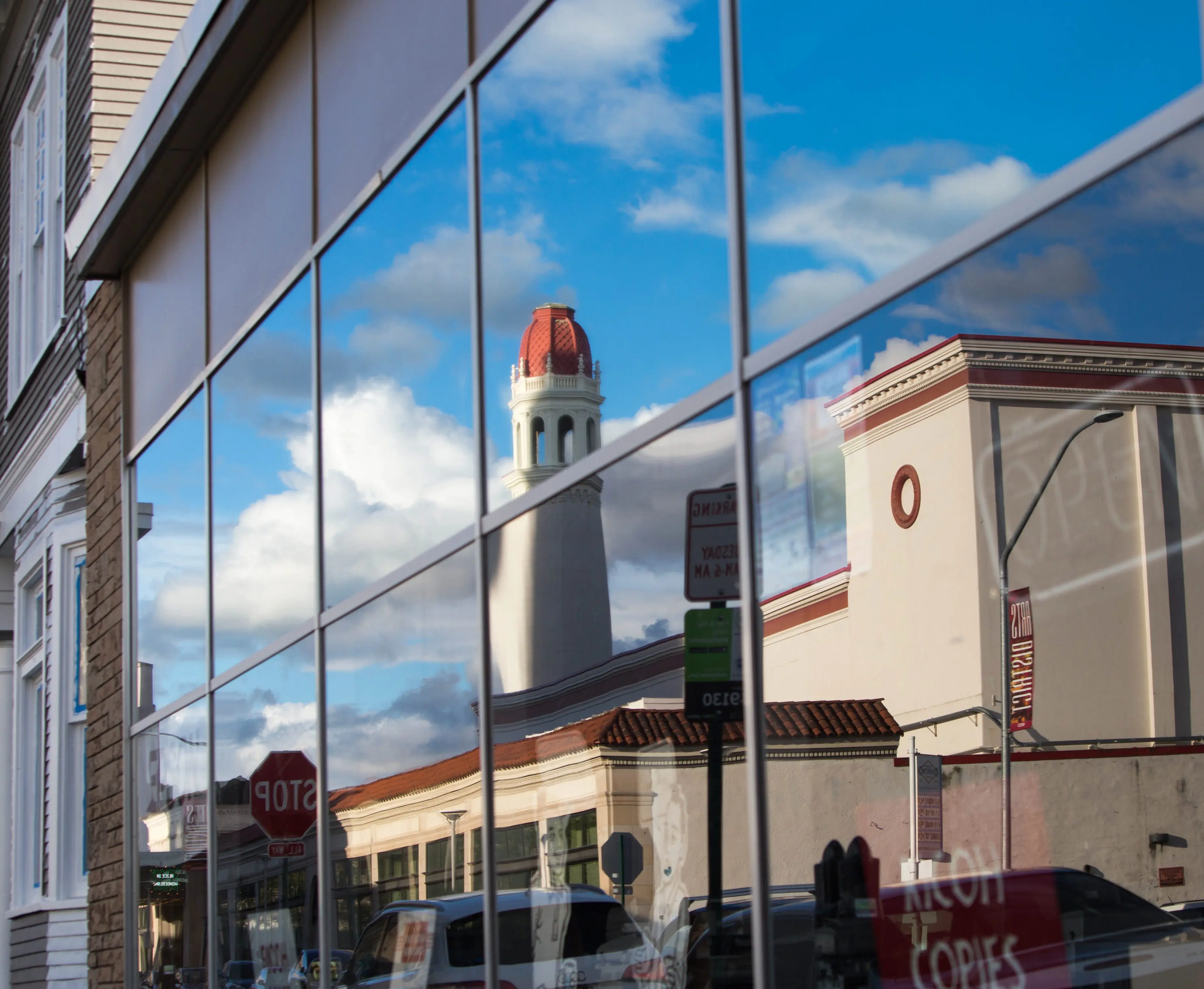 A reflection of a City street in a window