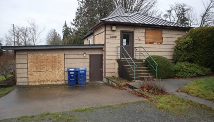 Boarded up building and garage