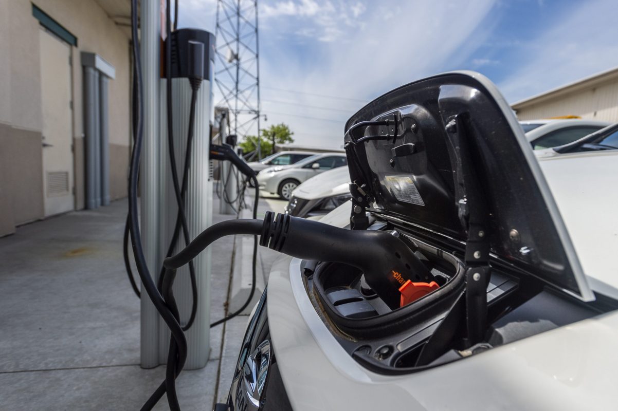 Electric car plugged into charger