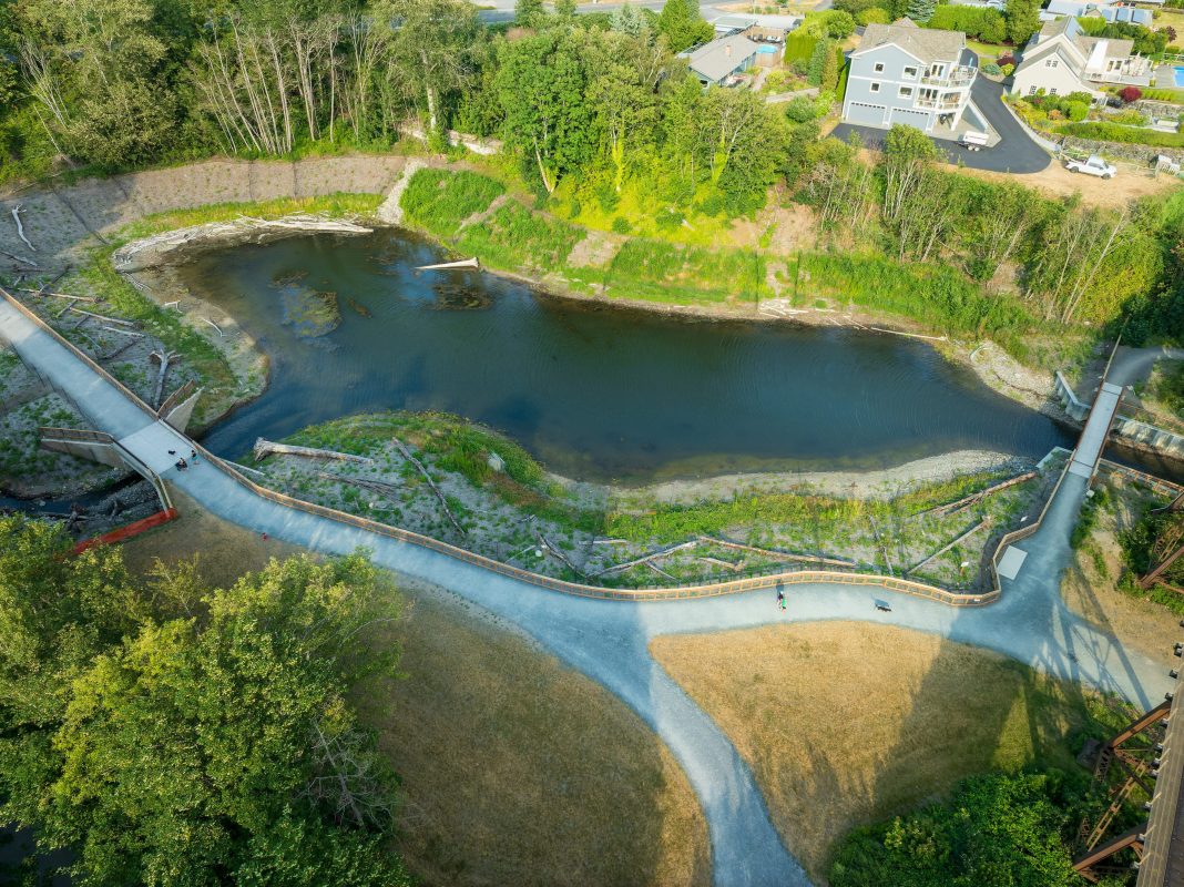 Aerial view of an estuary full of water on a sunny day