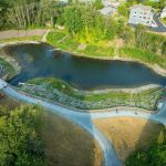 Aerial view of an estuary full of water on a sunny day