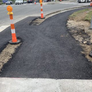 newly poured asphalt ramp still under construction