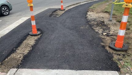 newly poured asphalt ramp still under construction