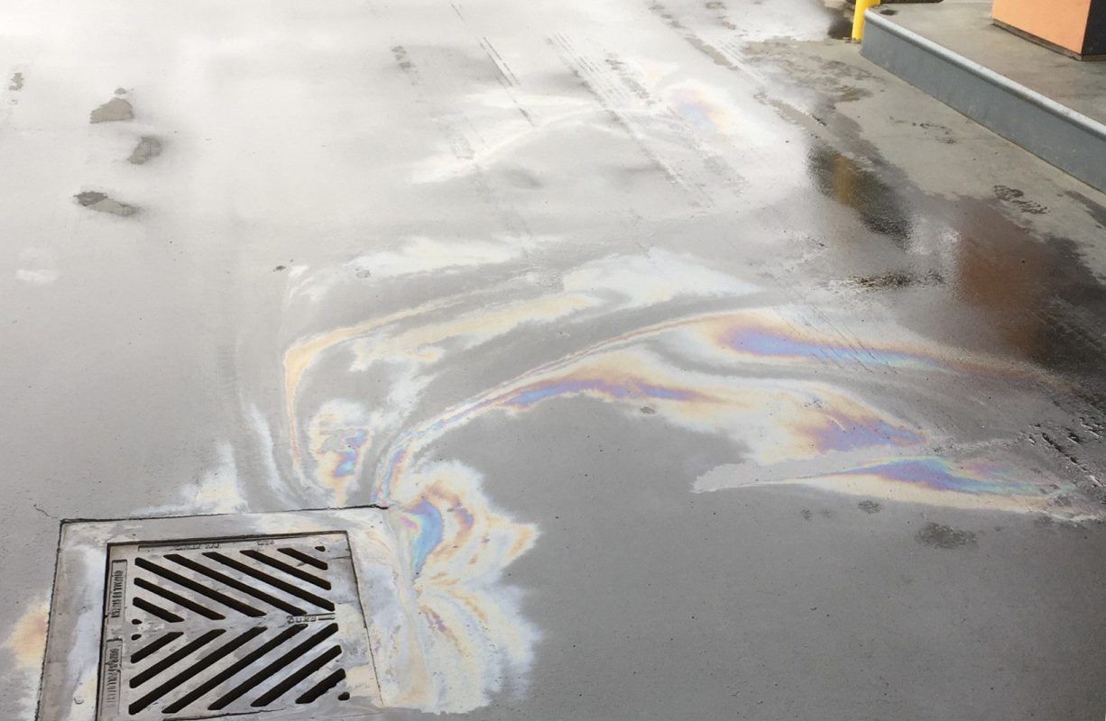 Oil flowing into storm drain