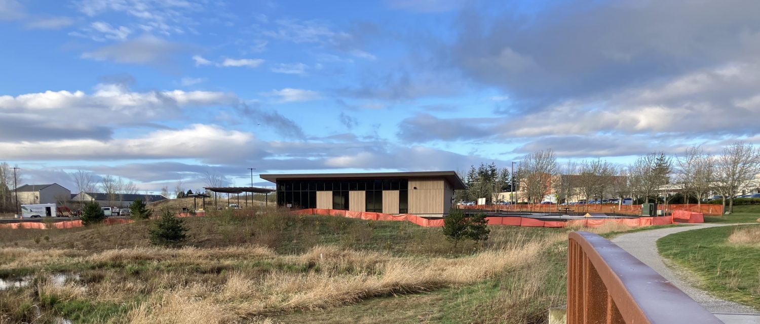 The new pavilion at Cordata Park in the distance, with park open space in the foreground