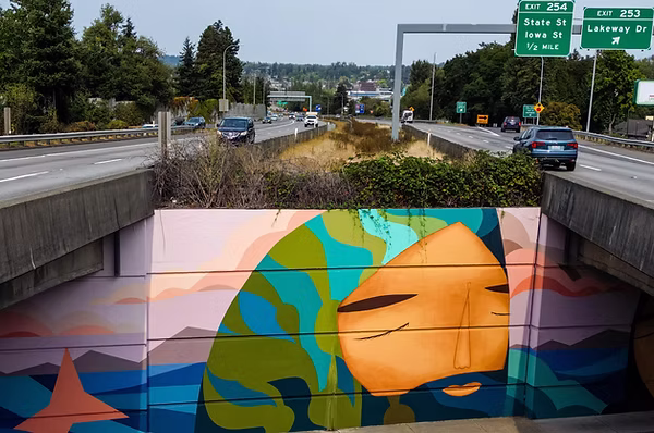 A large, colorful mural on Lakeway below I-5