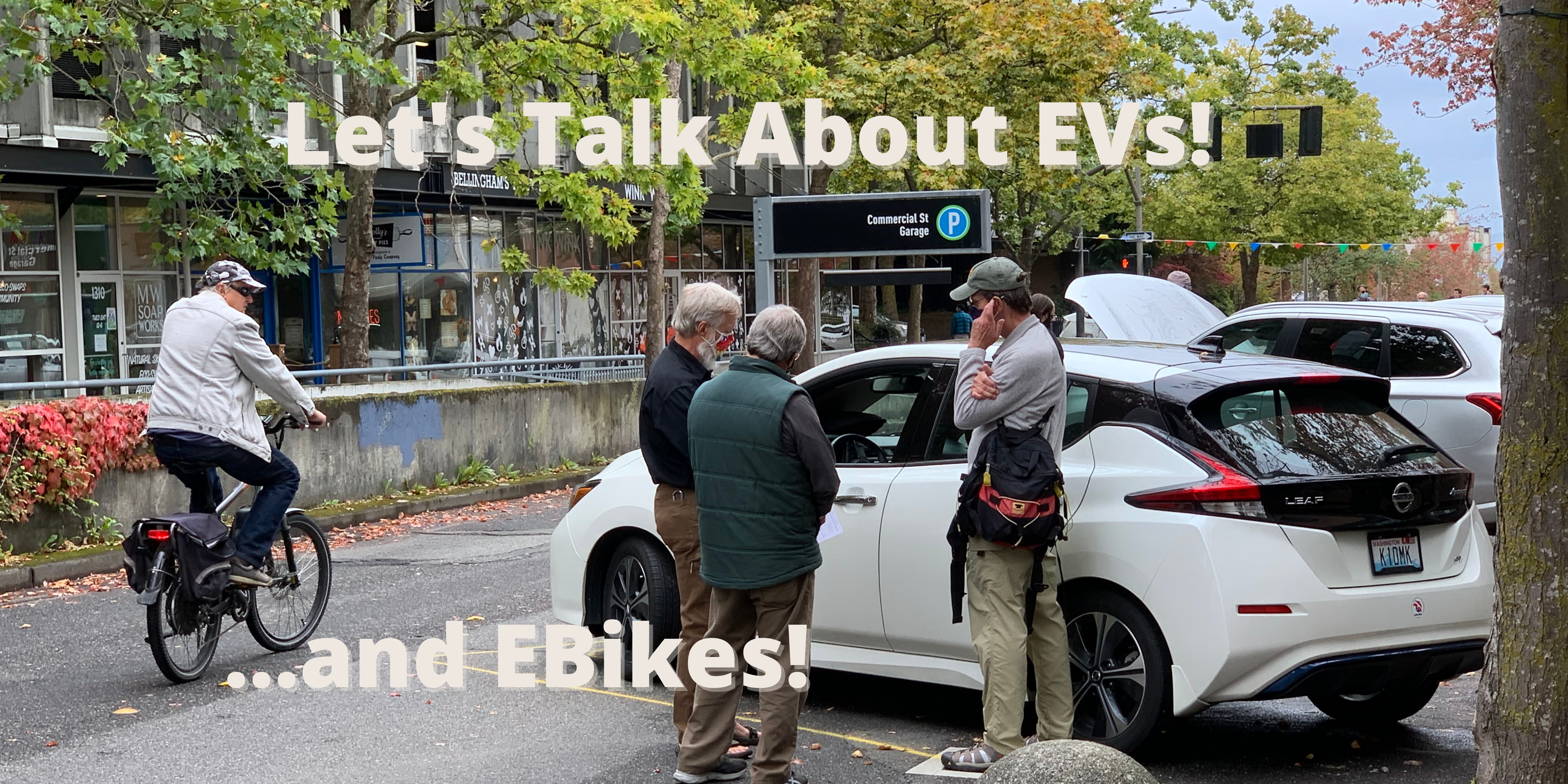 People standing around an electric vehicle talking. Text reads Let's talk about EVs and Ebikes!