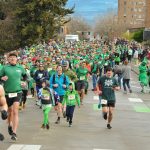 Hundreds of Runnin' O' the Green Participants race from the start of the annual event.