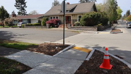 Street and sidewalk intersection of Russell Street and Illinois Street
