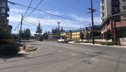 Intersection of street showing roadway and buildings along Samish Way