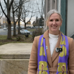 Mayor Kim Lund, wearing a Seattle FIFA World Cup scarf, is pictured on the steps oustide City Hall