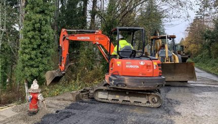 Construction equipment in roadway with fire hydrant nearby