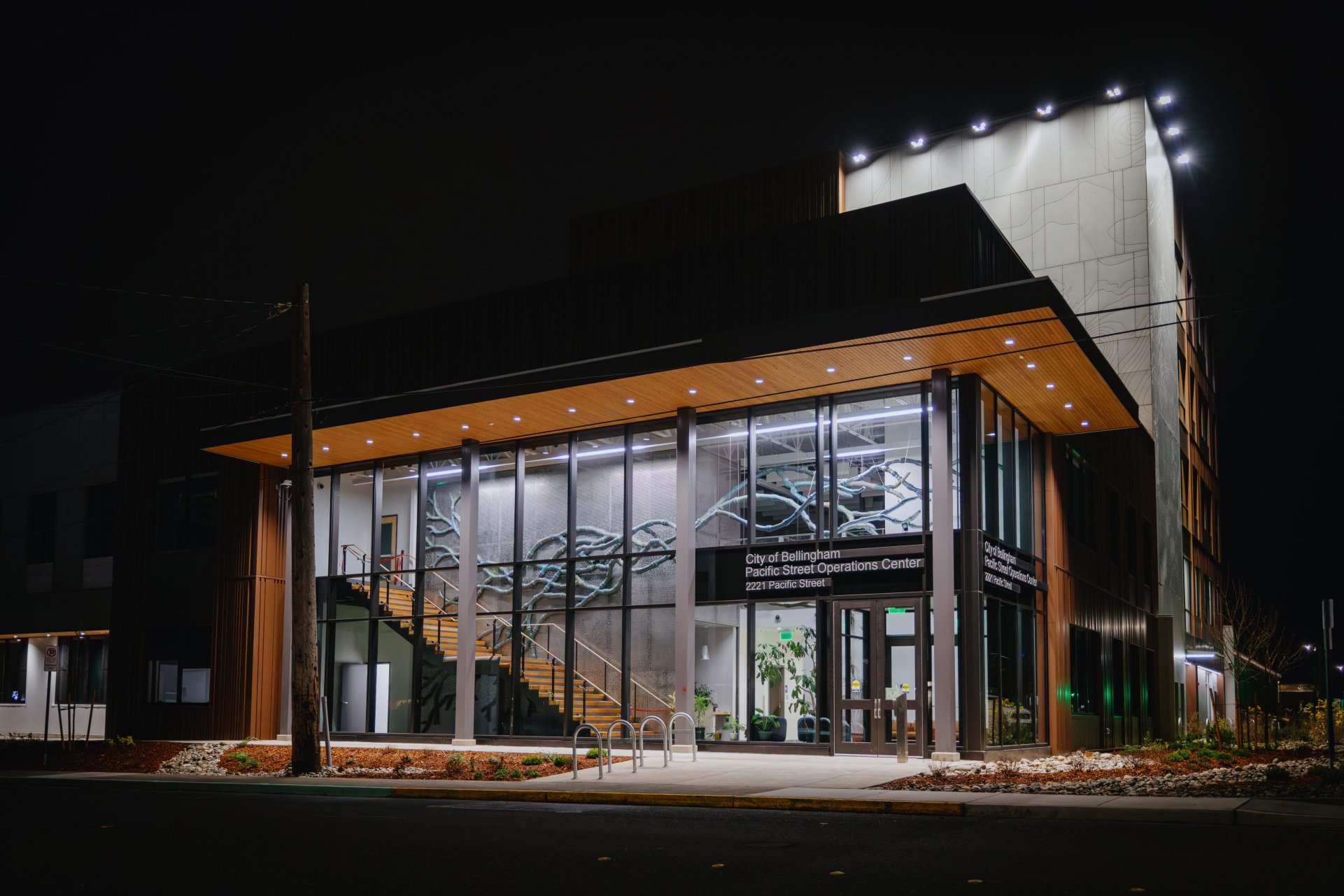 Outside facade of Pacific Street Operations Center at night